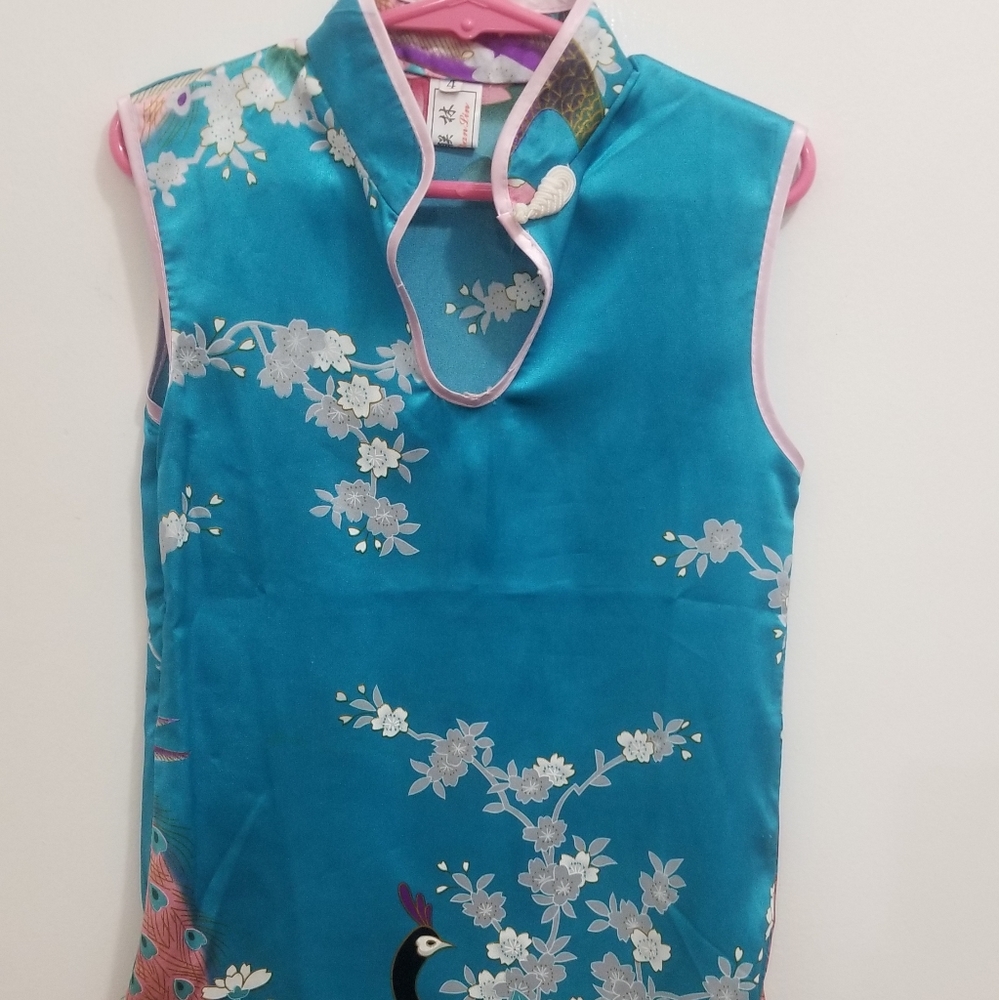 Turquoise dress with peacock